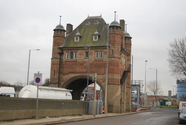 Historic brick entrance building at the Blackwall Tunnel beside the roadway.