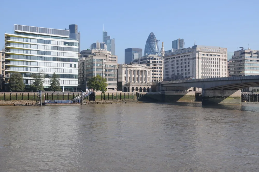 London Bridge crossing the Thames beside the City of London waterfront.
