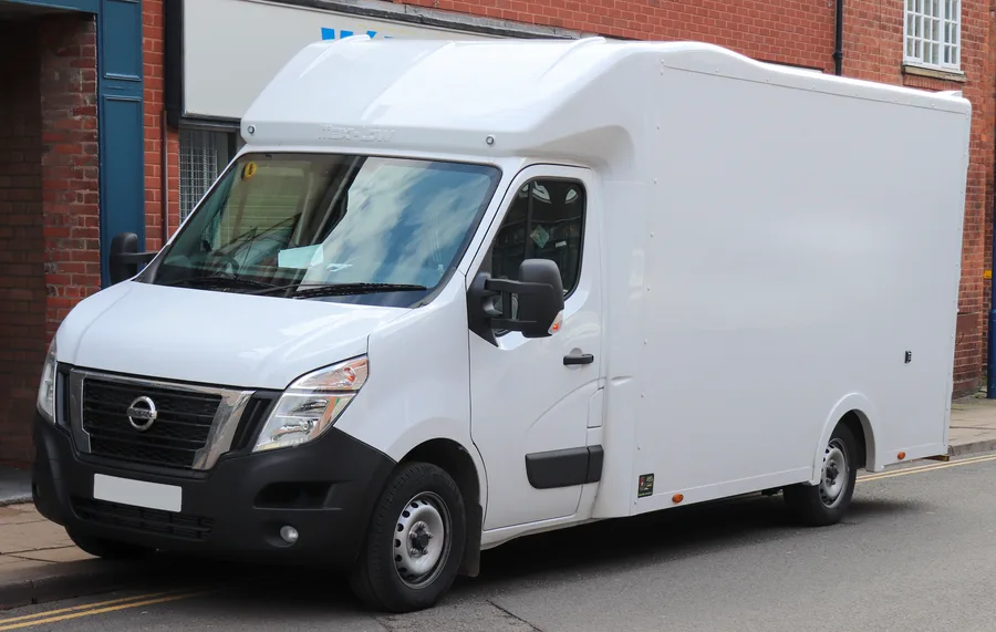 White Nissan NV400 low loader van with a low loading floor and tall enclosed box body